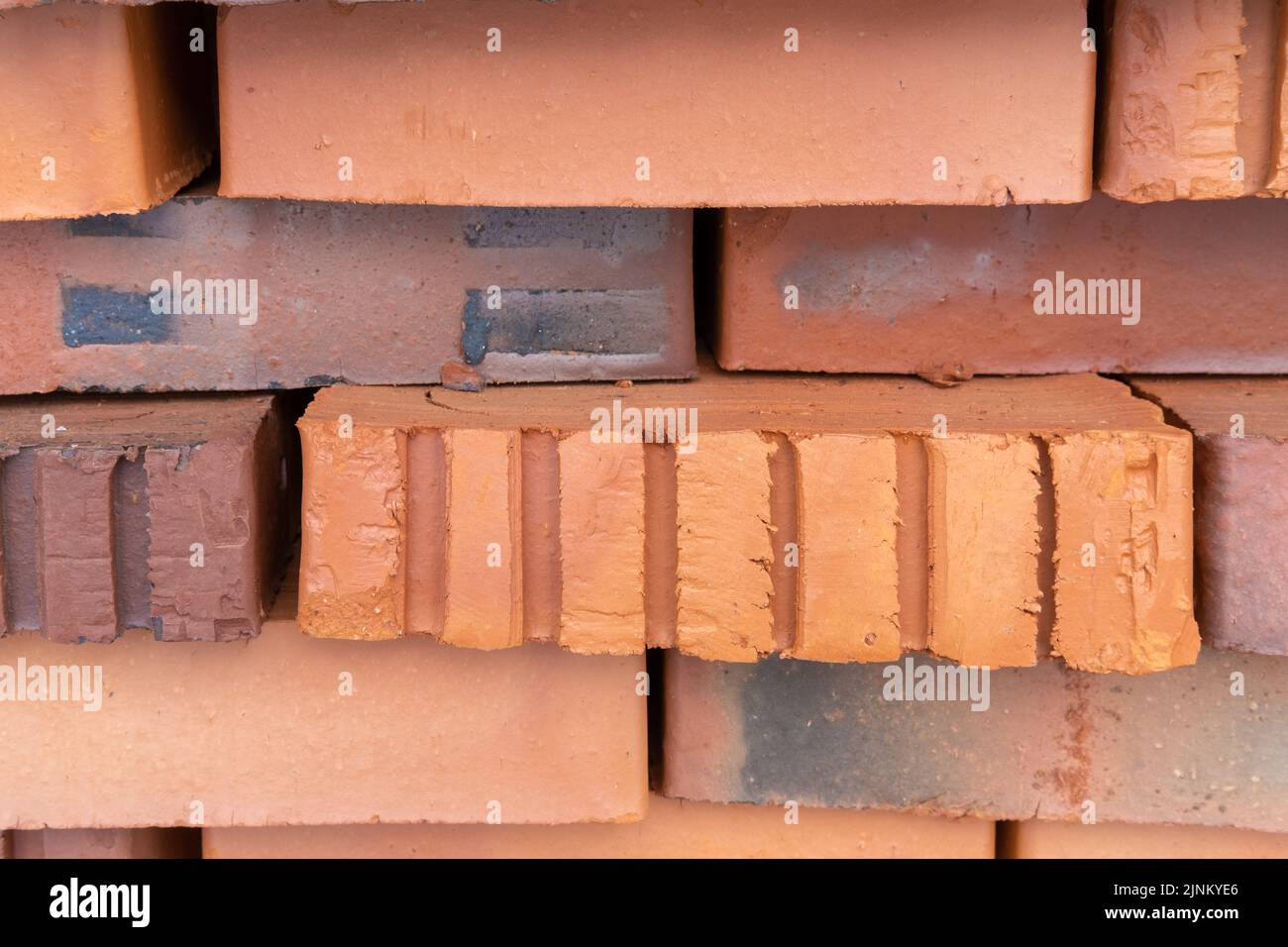 A stack of red bricks. Insulated building bricks. Red clay bricks are