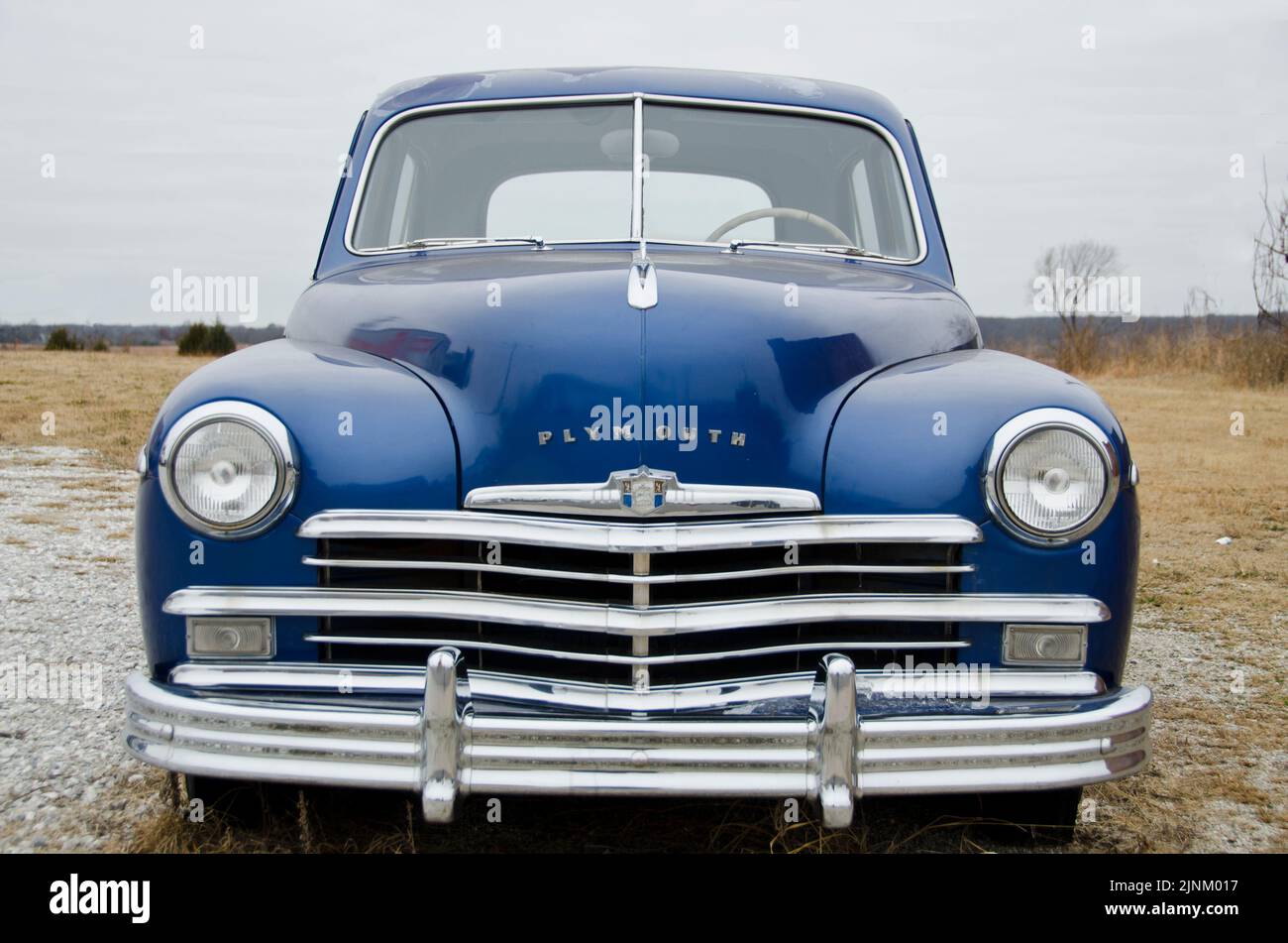 A beautiful blue 1949 Plymouth sedan sits in an abandoned field in Kansas, still in great shape! Stock Photo