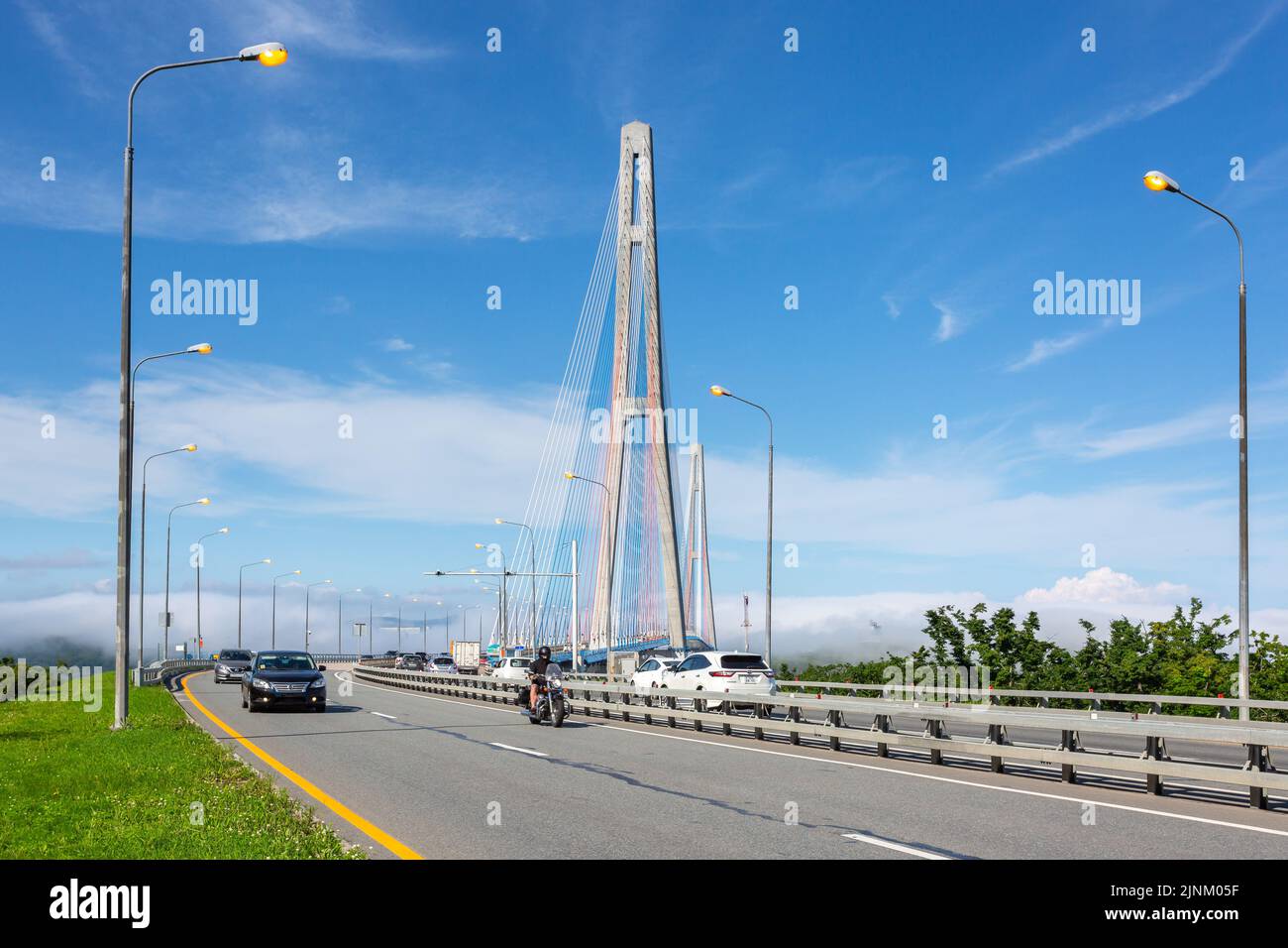 Cars drivind along the Cable-stayed Russky Bridge to island Russkiy in Vladivostok, Primorsky Krai, Russia Stock Photo