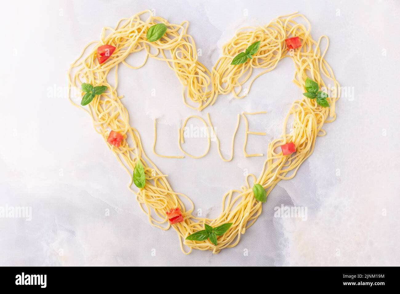 Decorative heart shaped pasta still life formed of pasta topped with