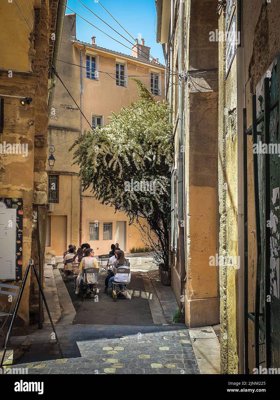 Aix-en-Provence, France, May 2022, view of people sitting at a terrace of a restaurant in the Passage Agard Stock Photo