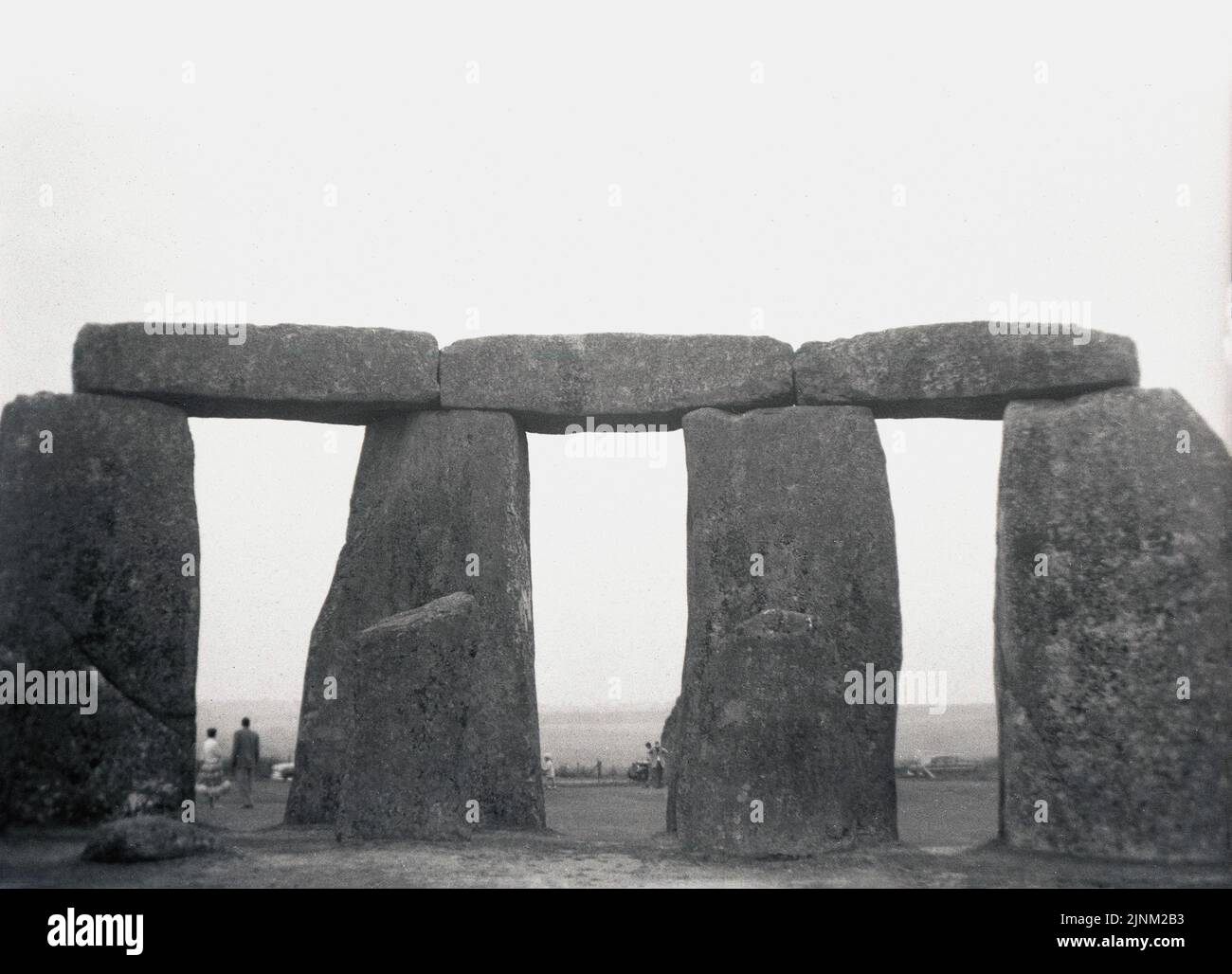 1950s, historical, view from this era of a section of four of the prehistoirc standing stones at Stonehenge on Salisbury Plain in Wiltshire, England, UK.  The whole monument consists of an outer ring of vertical sarsen standing stones, approx 13 feet high and seven feet wide, and weighing around 25 tons, topped by connecting horizontal lintel stones. Stock Photo