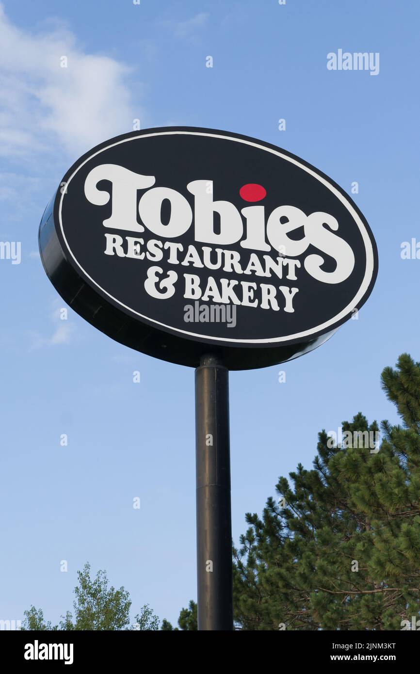 HINKLEY, MN, USA - JULY 9, 2022: Tobies Resturaunt and Bakery sign and trademark logo. Stock Photo