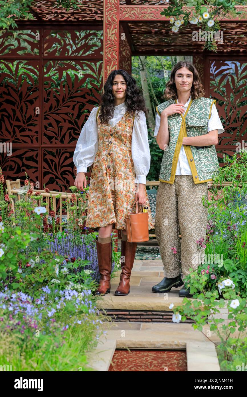 Models pose in the Morris & Co Garden,  Chelsea Flower Show Press day 2022, London Stock Photo