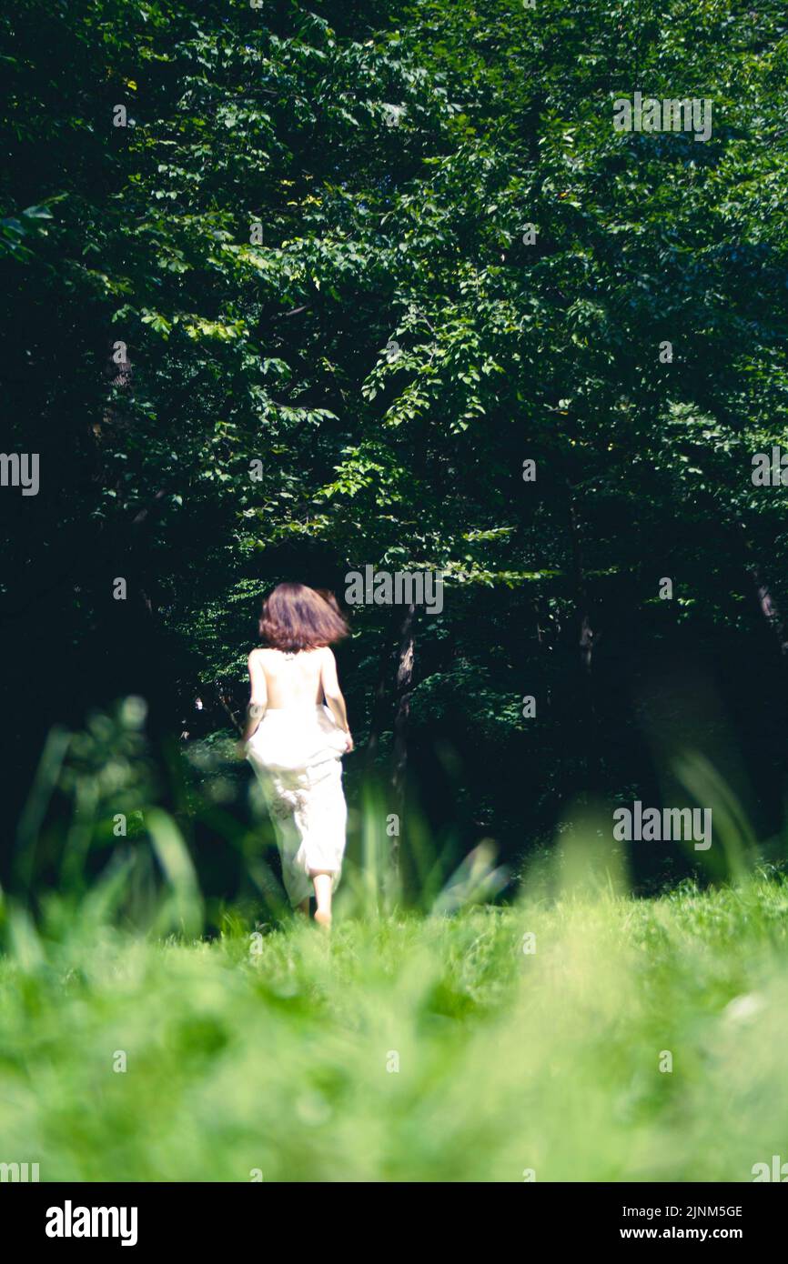Person in the forest hi-res stock photography and images - Alamy