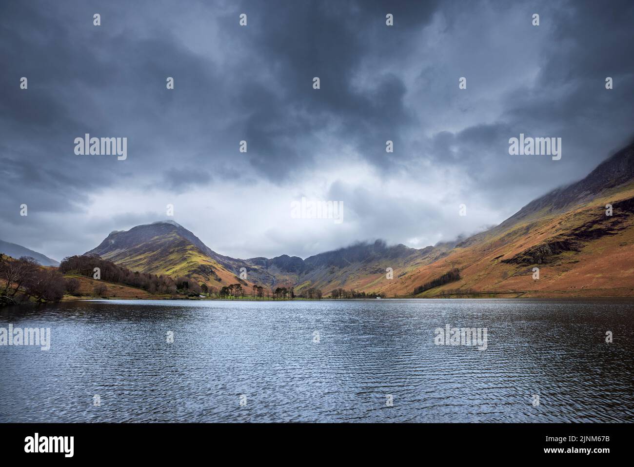 The southern shore of Buttermere with Fleetwith Pike and Hay Stacks in winter, Lake District, England Stock Photo