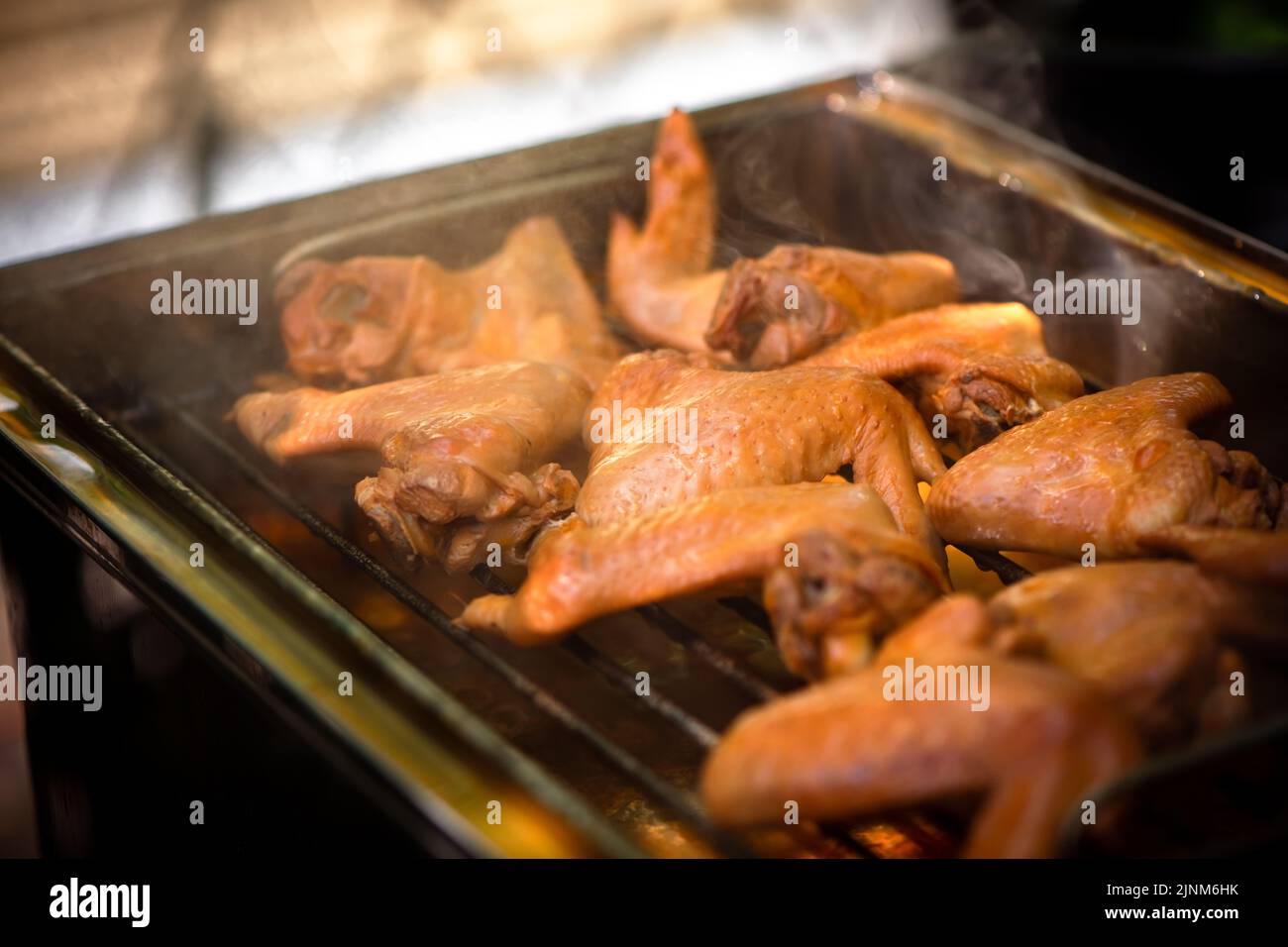 chicken wings smoked in a home smoker outdoorrs Stock Photo Alamy