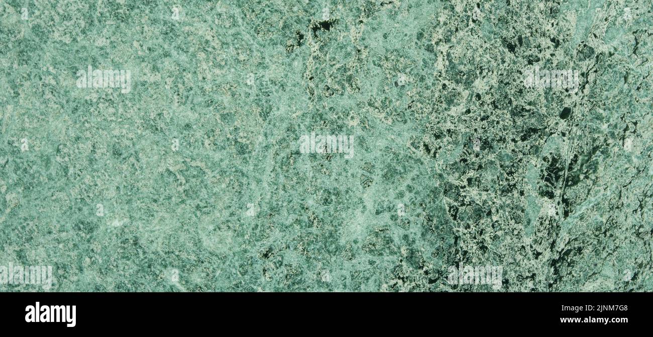 Green marble. Natural stone wall with abstract pattern. Stock Photo