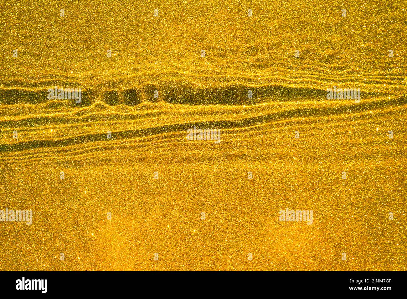 Abstract yellow background with golden sand texture underwater, with waves and ripples Stock Photo