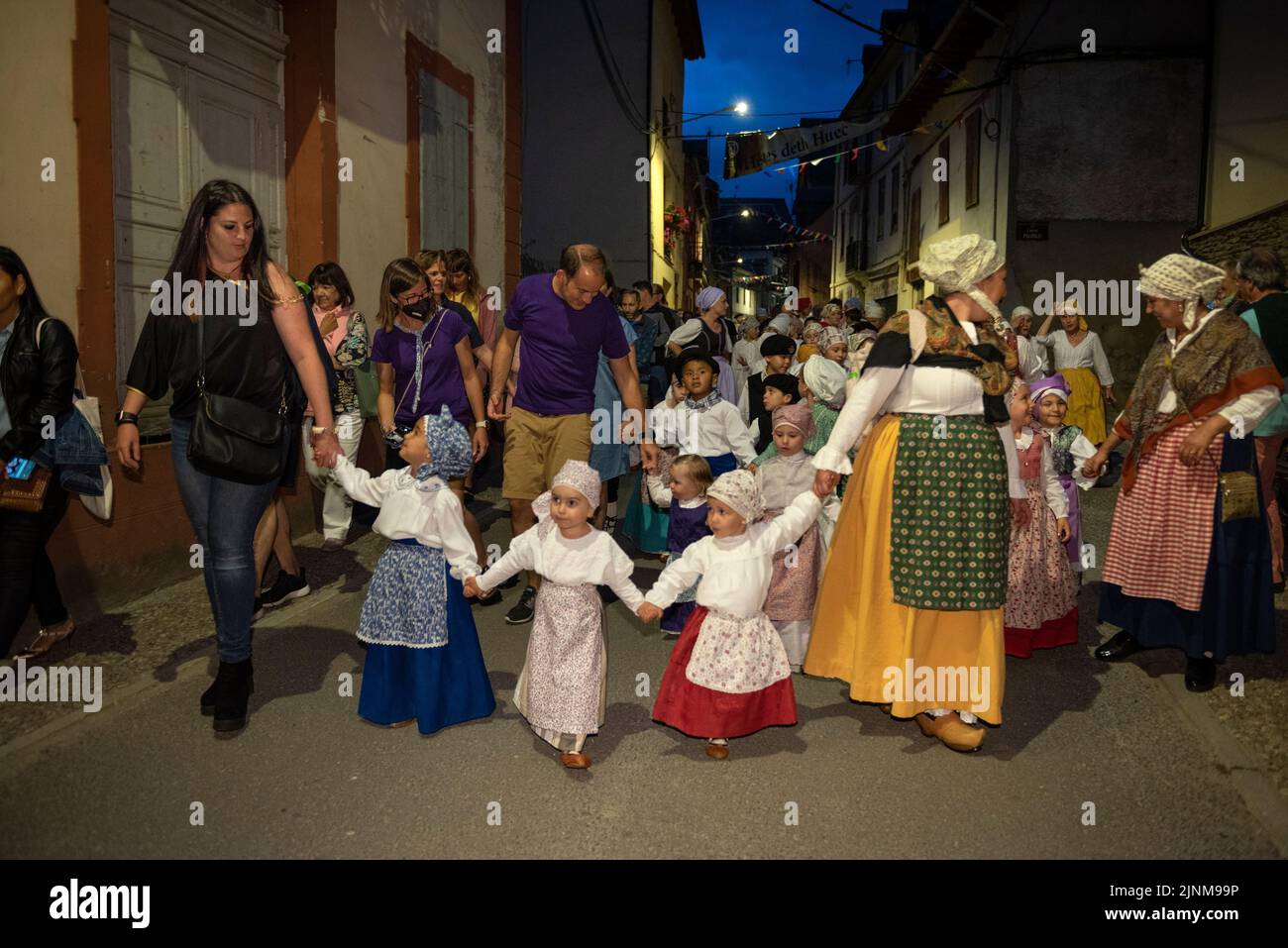 Procession of Saint John towards the Haro square in Les on the Sant Joan night festivity (Les, Aran Valley, Lleida, Catalonia, Spain, Pyrenees) Stock Photo