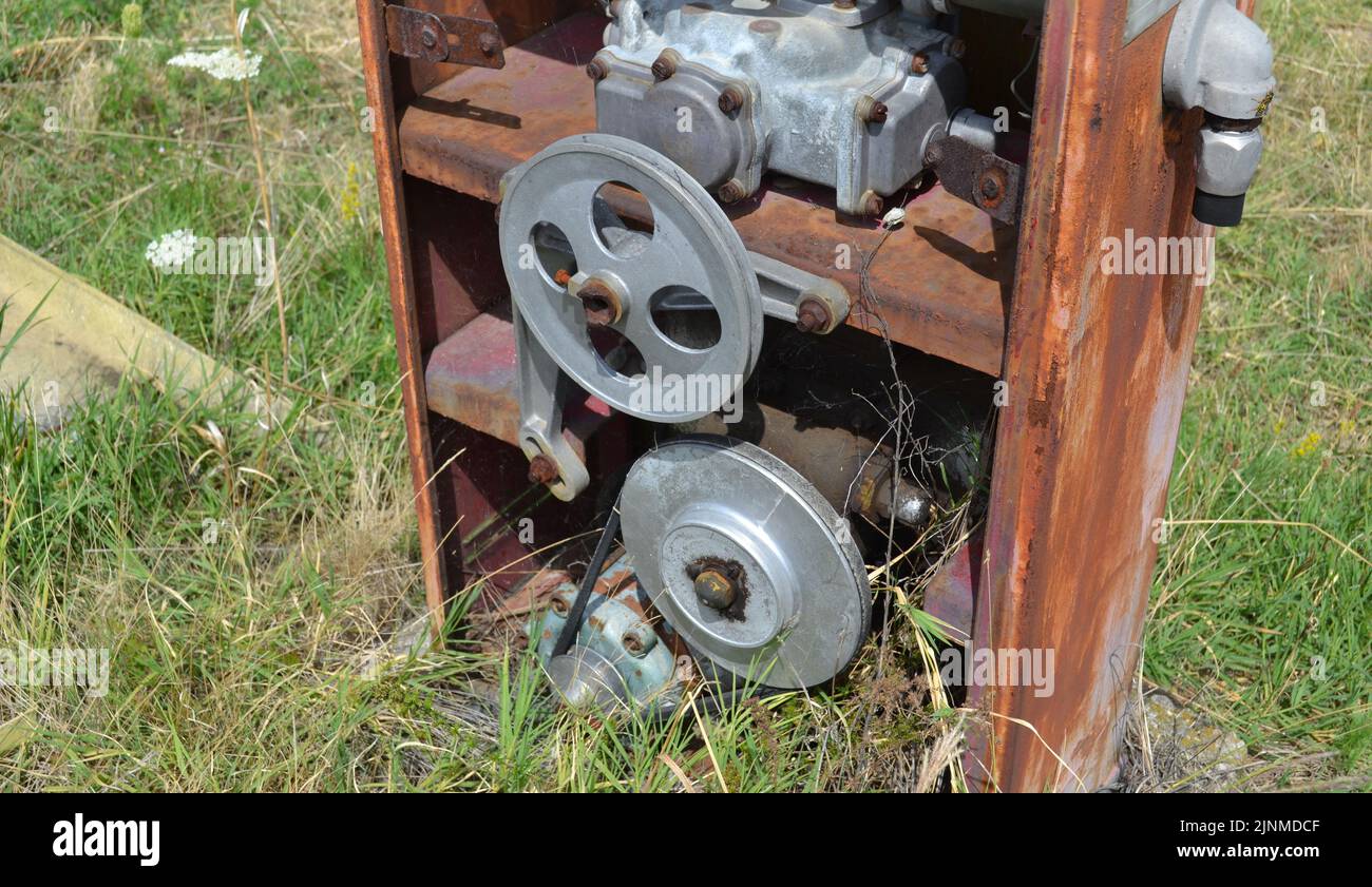 Broken mechanism on vintage and rusted gas pump Stock Photo Alamy