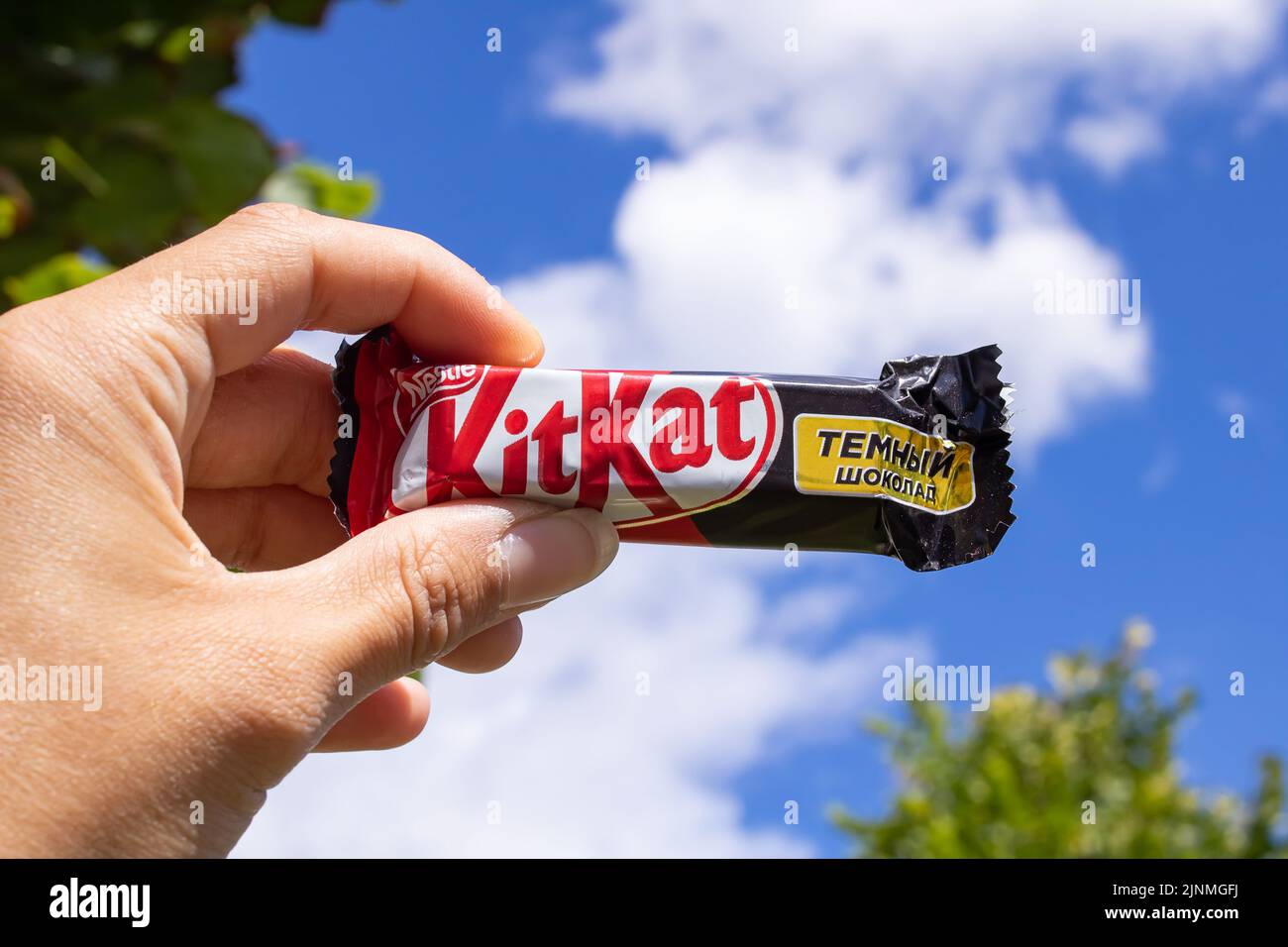 Belarus, Minsk 20 jule, 2022 KitKat bar in hand background of the