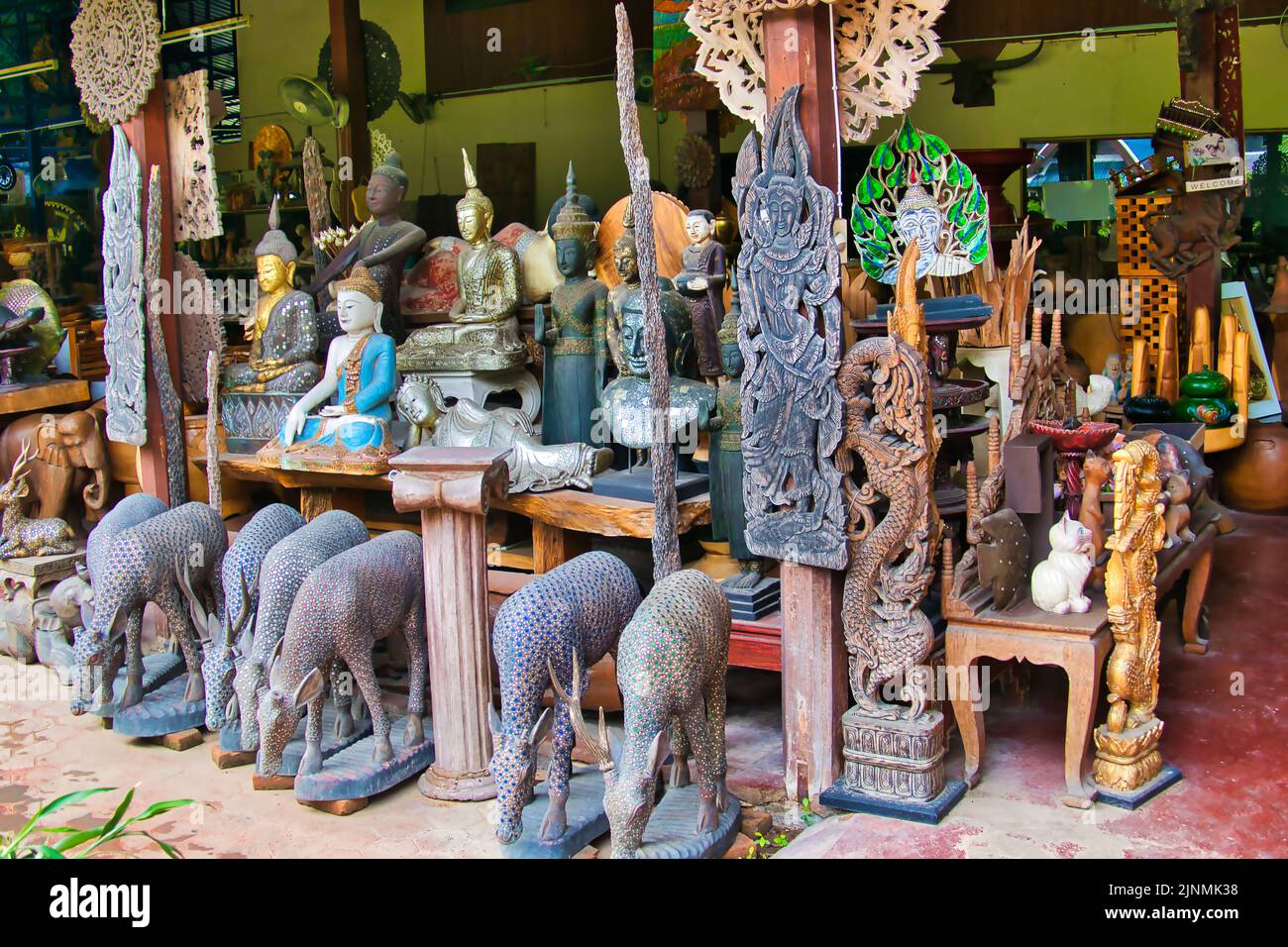 Store with buddhist religious sculptures in the artists village of Baan Tawai, Chiang Mai, Thailand. Stock Photo