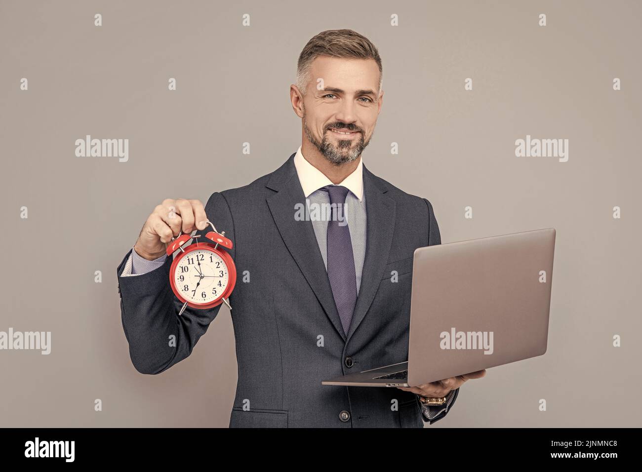 deadline. time. mature businessman working online. business success. time management. Stock Photo