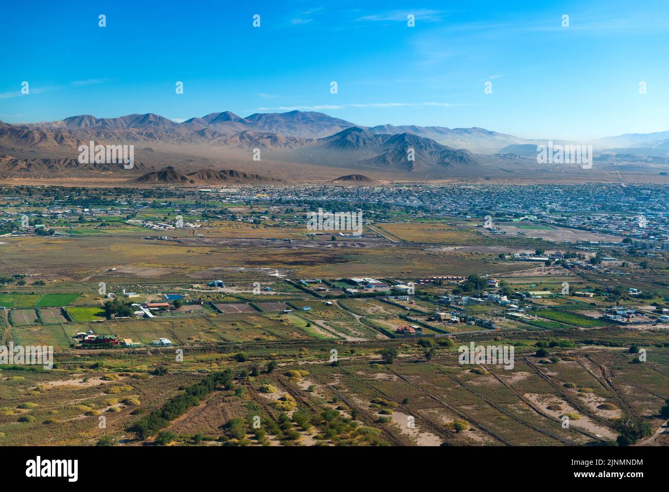 Aerial view of the mining city of Calama in northern Chile with Chuquicamata copper mine in the back. Stock Photo