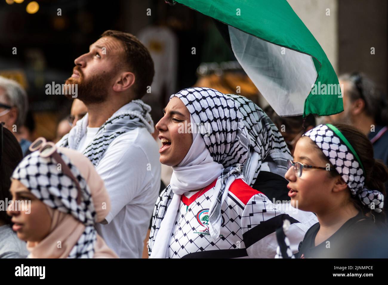Madrid, Spain. 12th Aug, 2022. Protesters are seen shouting slogans during a demonstration where the Palestinian community gathered in front of the Ministry of Foreign Affairs to protest against the recent military offensive on the Gaza Strip by Israel, which has caused the death of 46 people, 16 of them minors. Credit: Marcos del Mazo/Alamy Live News Stock Photo