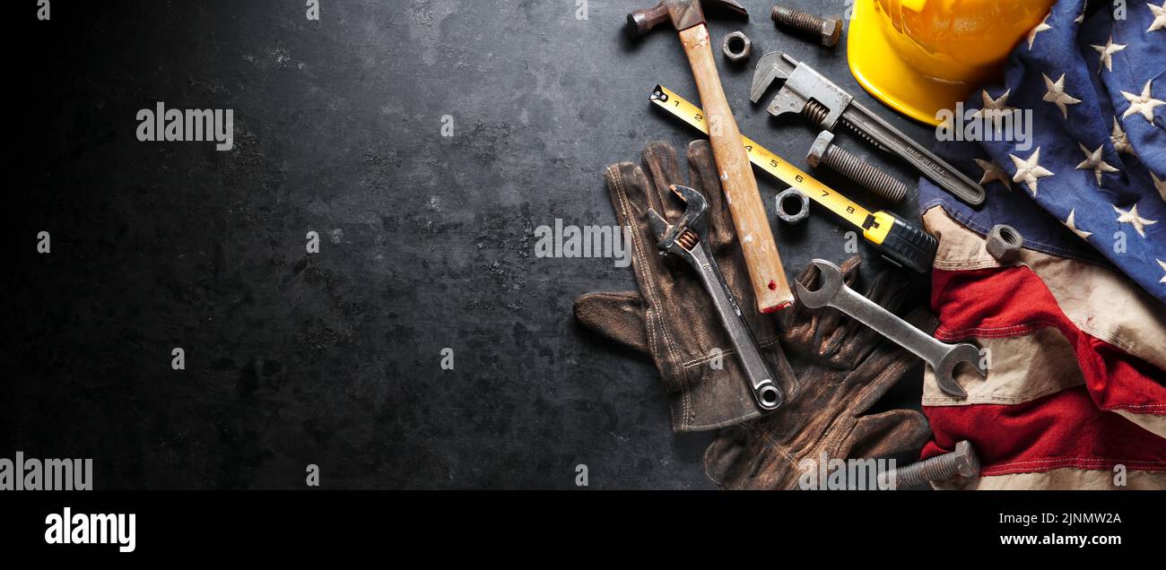 Construction and manufacturing tools with patriotic US, USA, American flag on dark black background Stock Photo