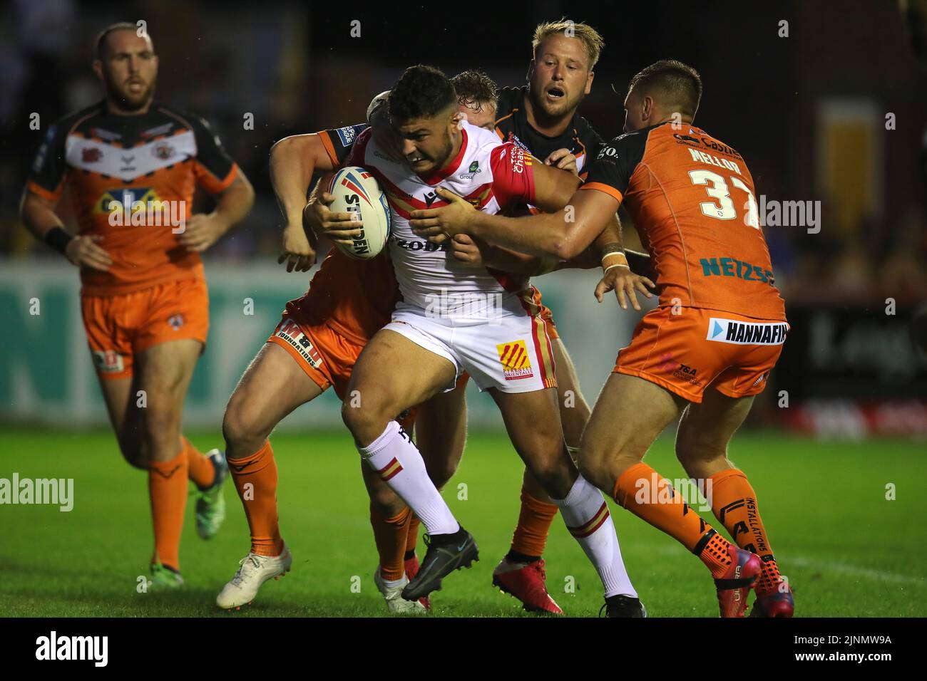 Catalans Dragons' Mathieu Cozza is tackled during the Betfred Super League match at The Mend-A-Hose Jungle, Castleford. Picture date: Friday August 12, 2022. Stock Photo