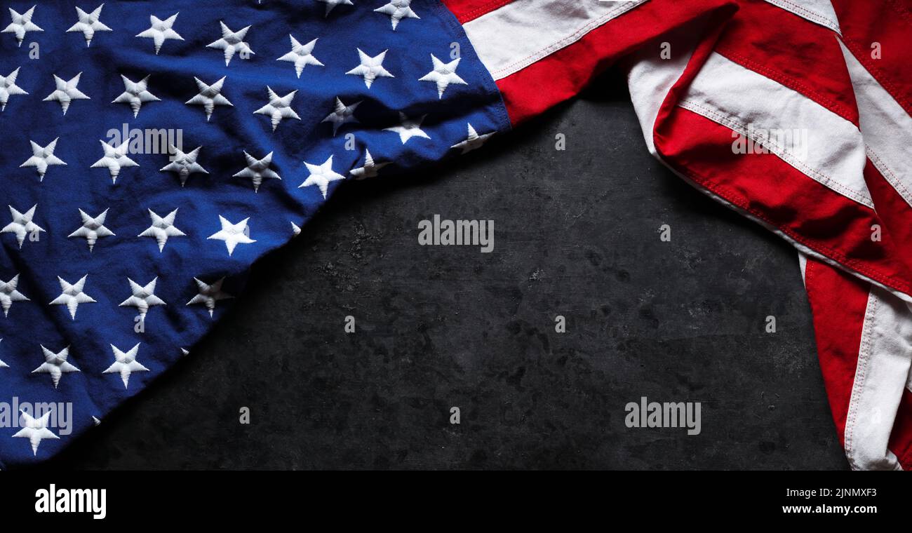 US American flag on worn black background. For USA Memorial day, Veteran's day, Labor day, or 4th of July celebration. With blank space for text. Stock Photo