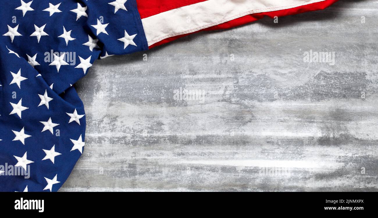 US American flag on worn white wooden background. For USA Memorial day, Veteran's day, Labor day, or 4th of July celebration. With blank space for tex Stock Photo