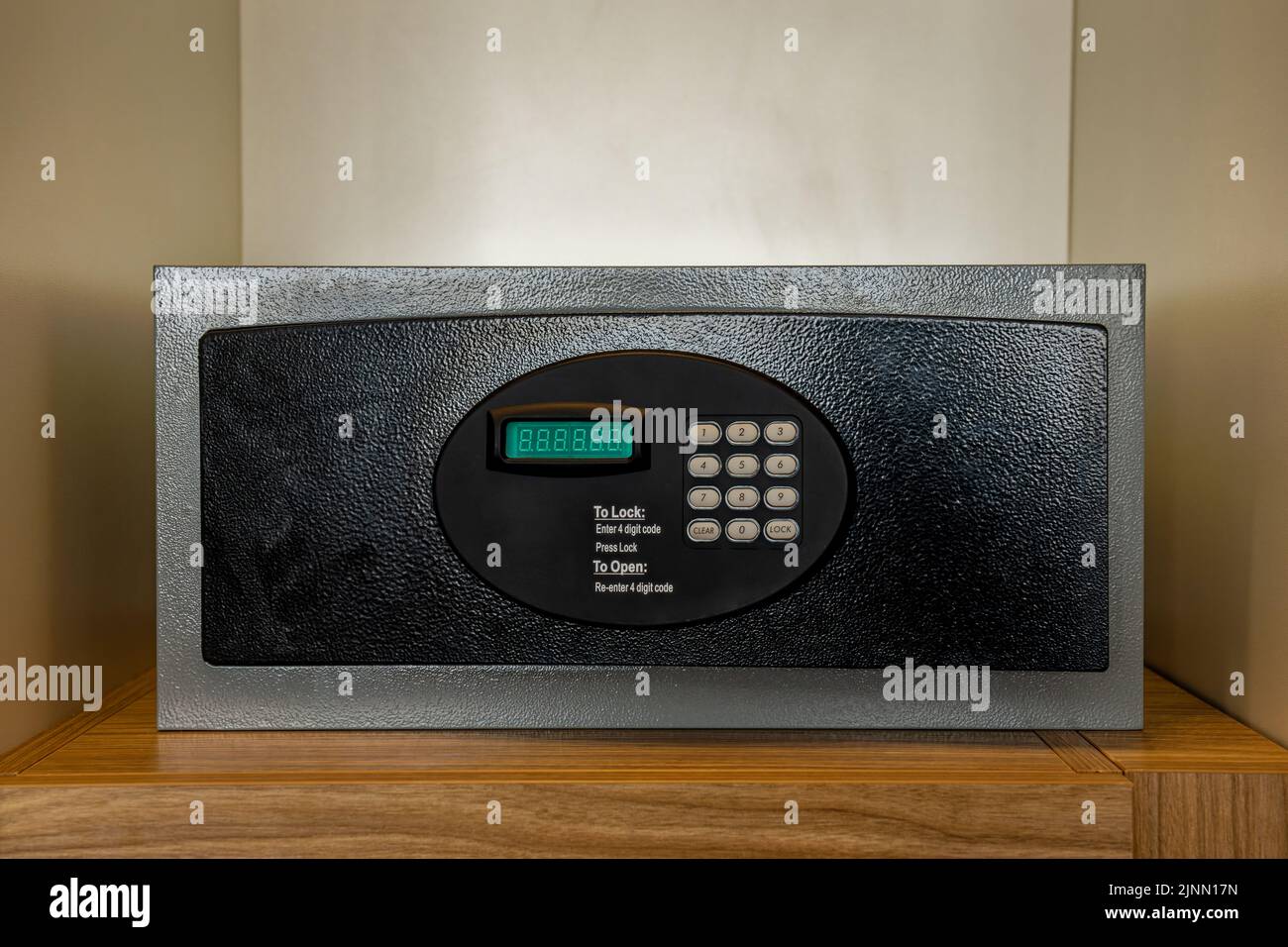 front loading in-room hotel safe with electronic lock located inside a closet.has a keypad and seven-segment LED display Stock Photo