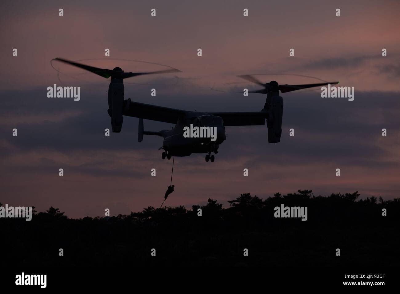 U.S. Marines with Marine Wing Support Squadron (MWSS) 171 fast rope out ...