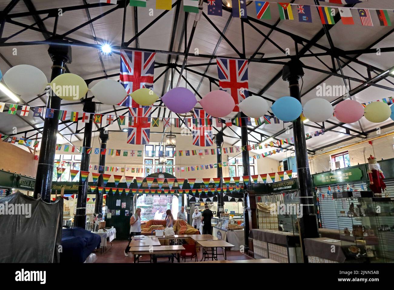 Interior of Nantwich Market, Market Street, Nantwich, Cheshire, England, UK, CW5 5DG, flags for the queens jubilee 2022 Stock Photo