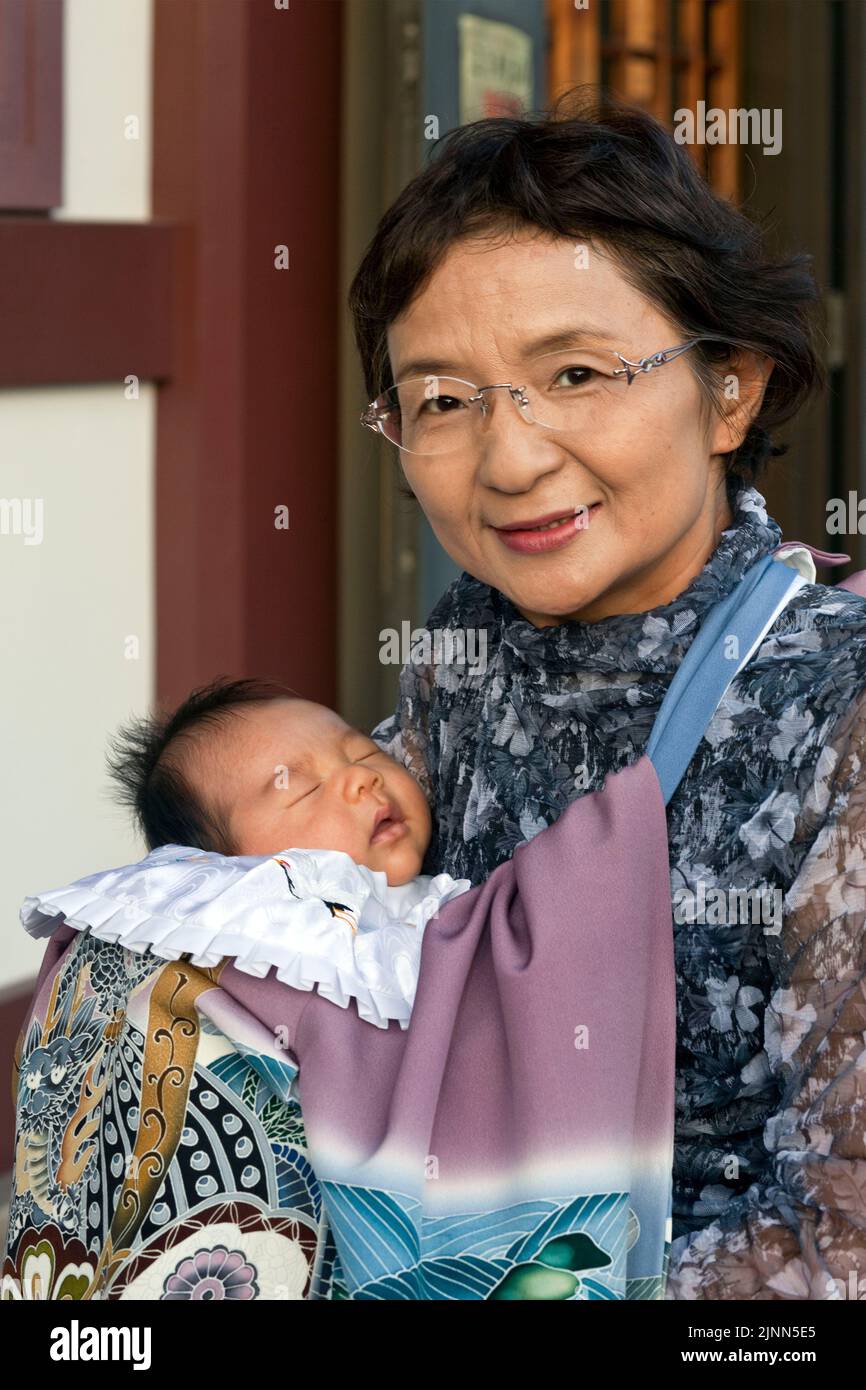 Grandmother w grandson Kawasaki Temple Japan V Stock Photo