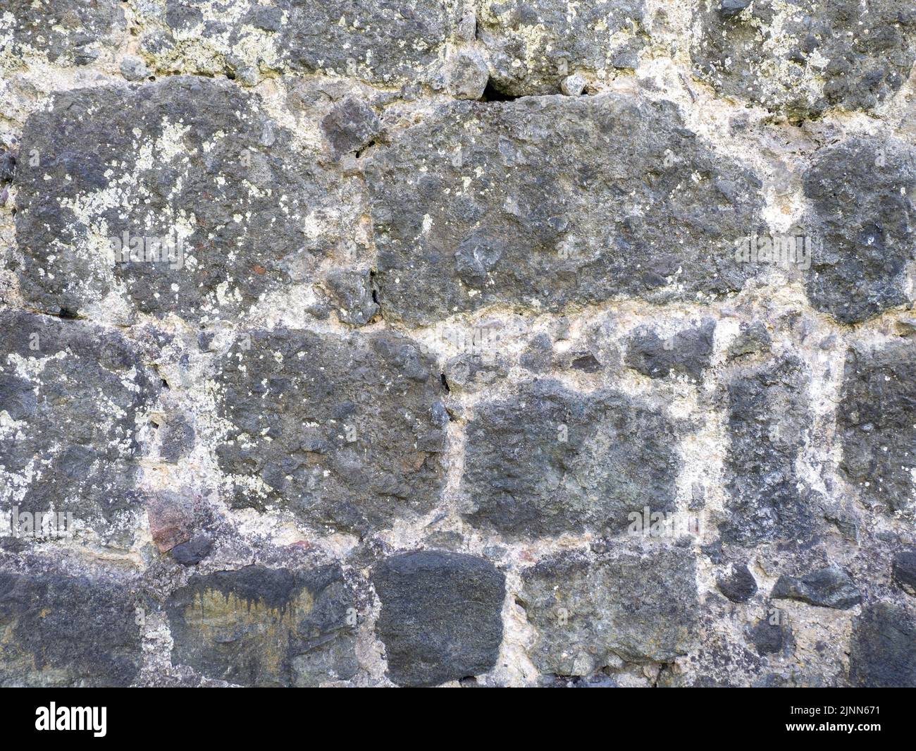 Antique stone wall. Background from a gray stone. The architecture of ...