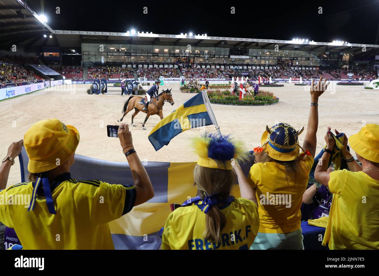Herning, Denmark. 12th Aug, 2022. Equestrian sport; World Championship, Jumping. Fans of the Swedish team are pleased with the ride of Malin Baryard-Johnsson (Sweden) on H&M Indiana. Credit: Friso Gentsch/dpa/Alamy Live News Stock Photo