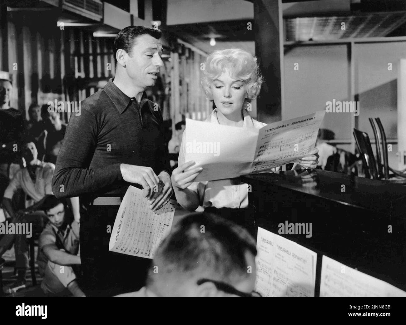 Monroe with Yves Montand in Let's Make Love (1960), which she agreed to make only to fulfill her contract with Fox Stock Photo