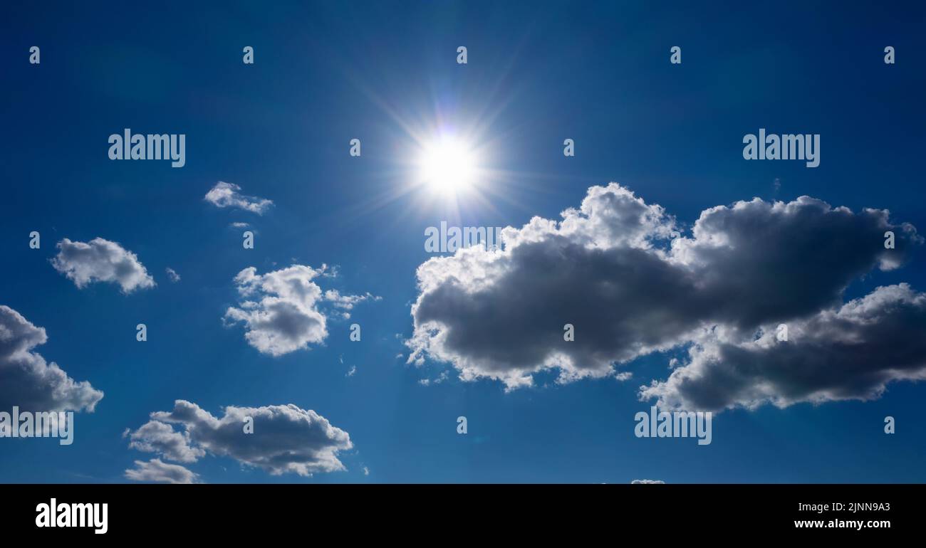 Bright sun in the blue sky. natural background. Stock Photo