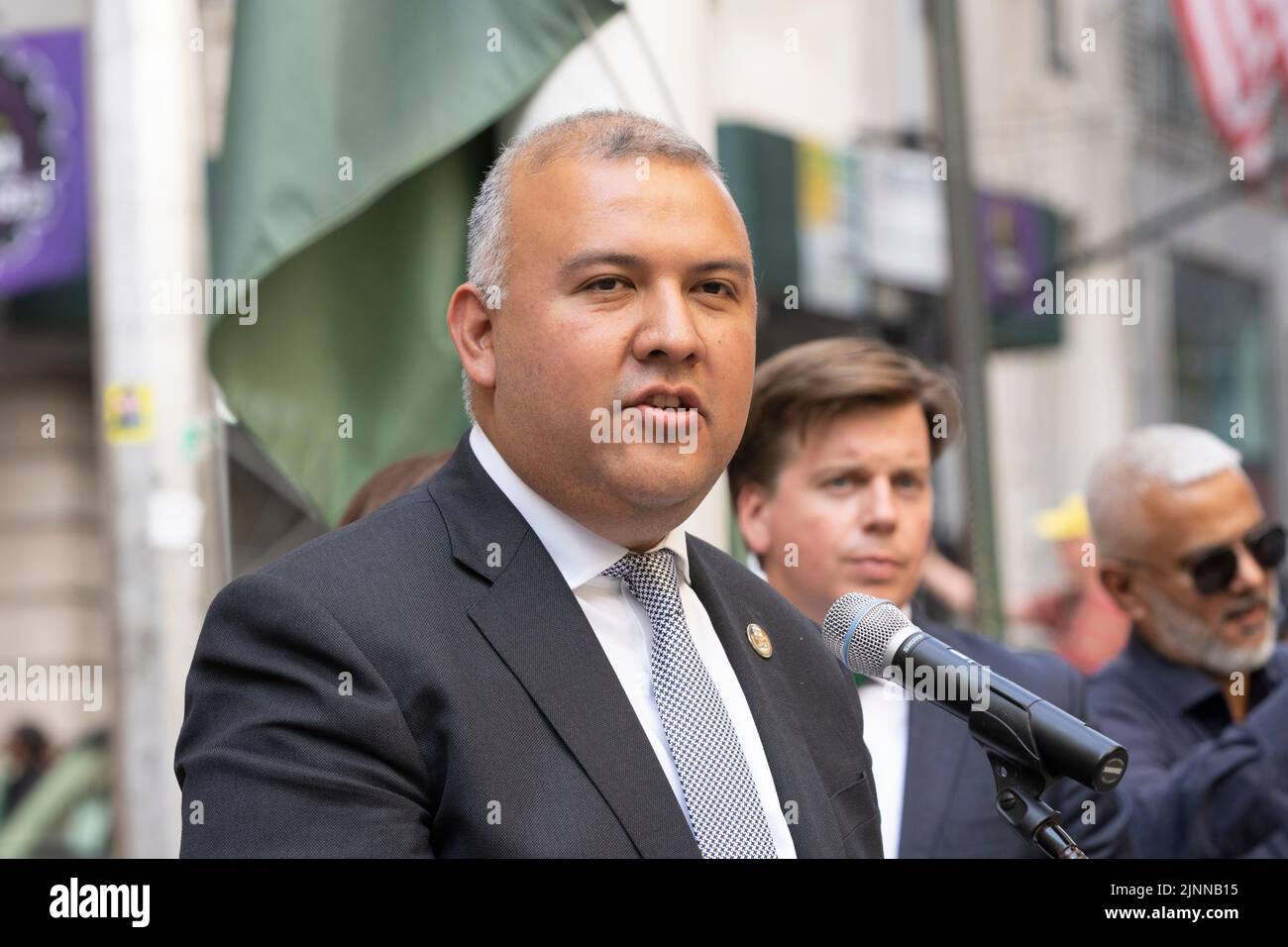 New York, NY - August 12. 2022: Commissioner of Immigrant Affairs Manuel Castro speaks during ceremony of Pakistani flag raising at Bowling Green Park Stock Photo