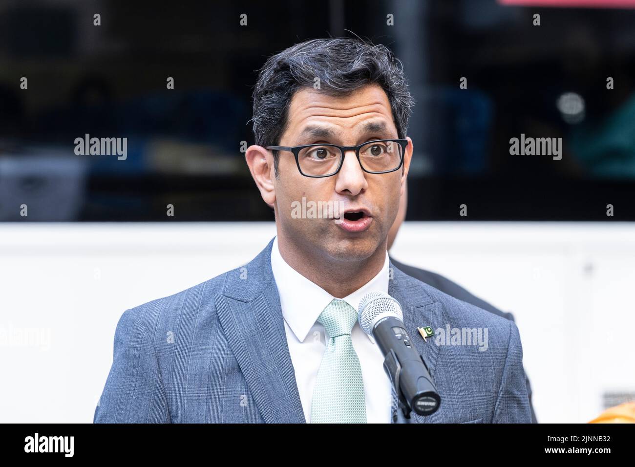 New York, NY - August 12. 2022: Commissioner of Office of Administrative Trials and Hearings Asim Rehman speaks during ceremony of Pakistani flag raising at Bowling Green Park Stock Photo