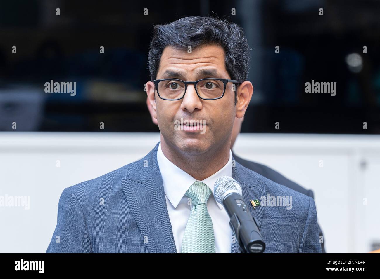 New York, NY - August 12. 2022: Commissioner of Office of Administrative Trials and Hearings Asim Rehman speaks during ceremony of Pakistani flag raising at Bowling Green Park Stock Photo