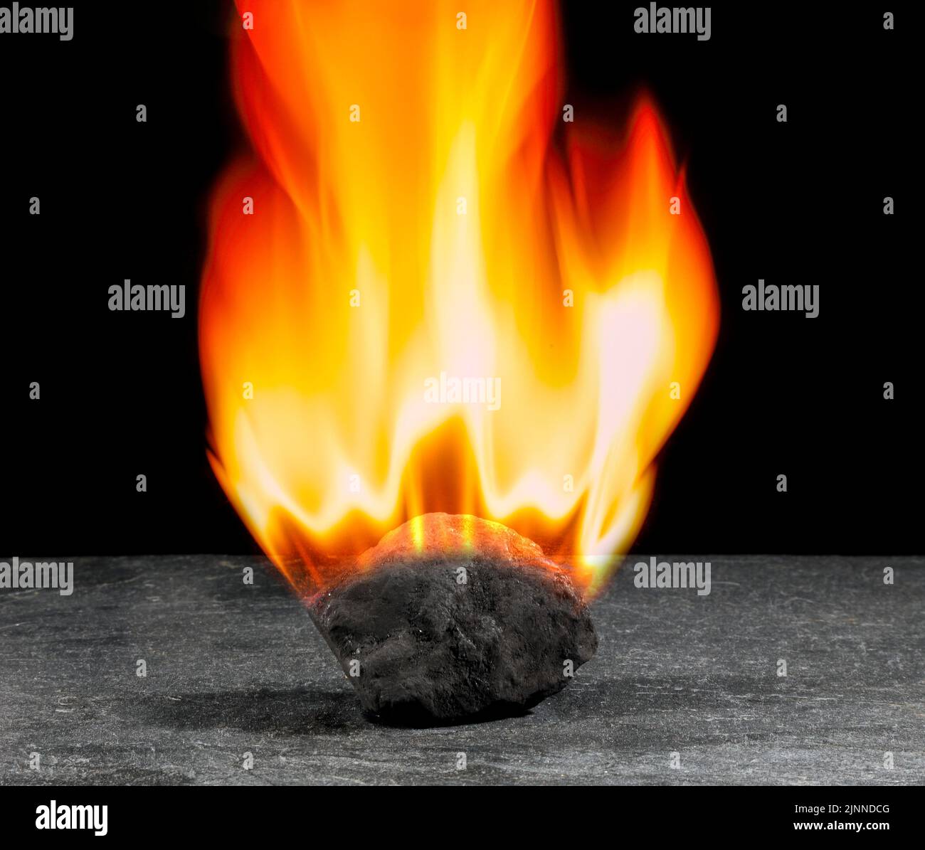Burning lump of coal, illustration Stock Photo