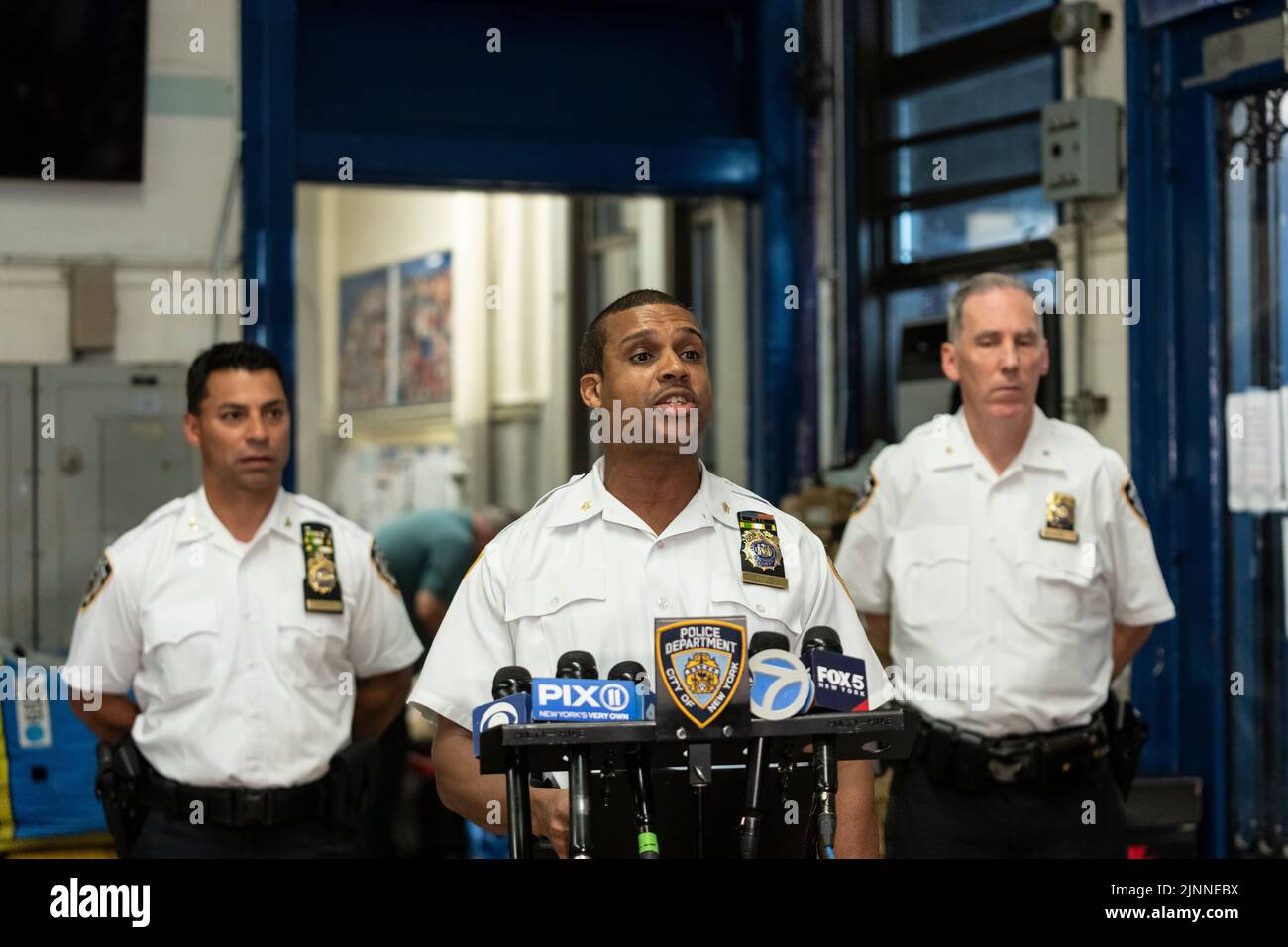 New York, NY - August 12, 2022: Deputy Chief of Patrol Service Bureau Benjamin Gurley briefs press of counterfeit operation at Traffic Control Division precinct Stock Photo