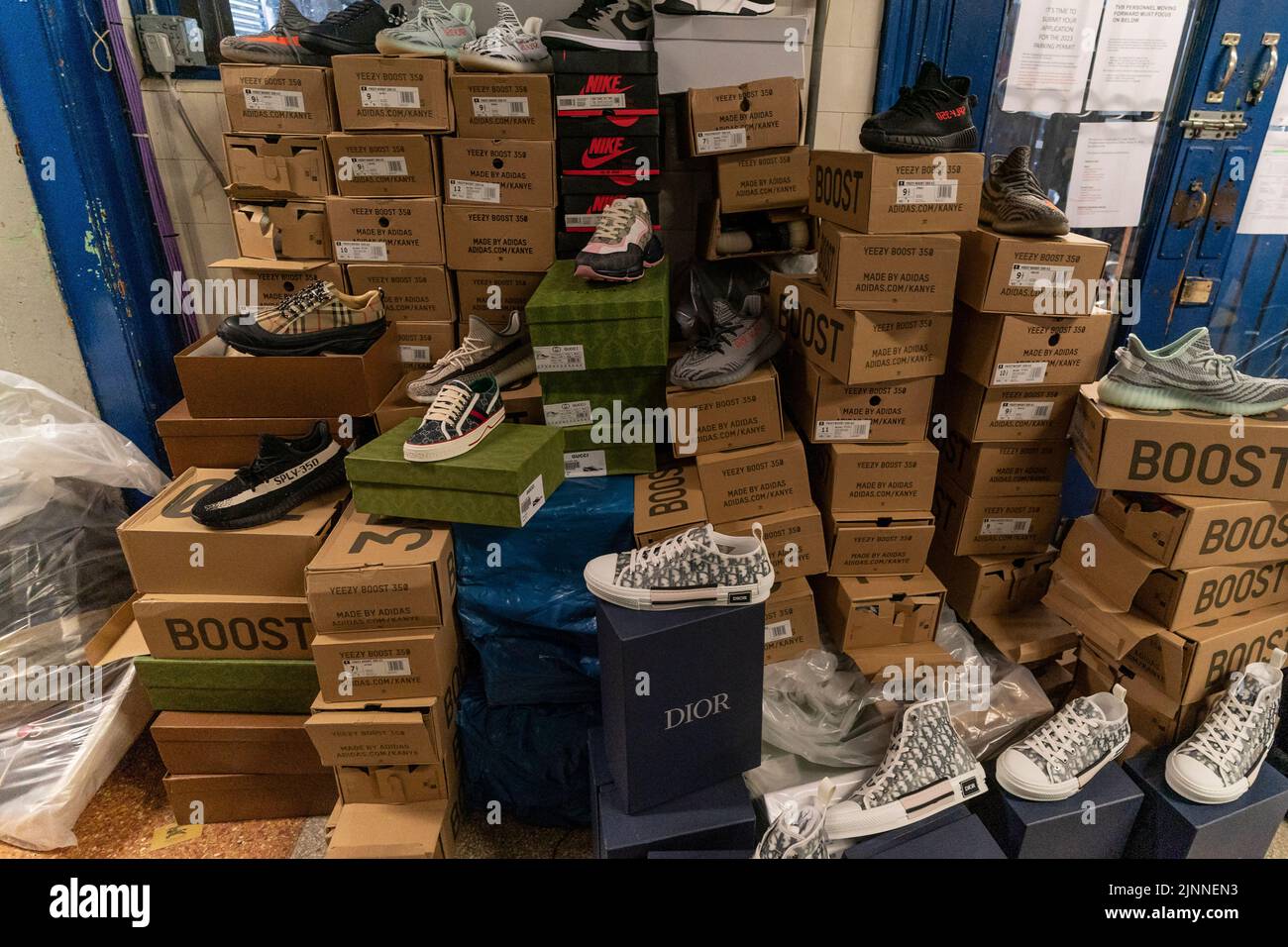 New York, NY - August 12, 2022: counterfeit merchandise on display during NYPD press conference after conclusion of police operation at Traffic Control Division precinct Stock Photo