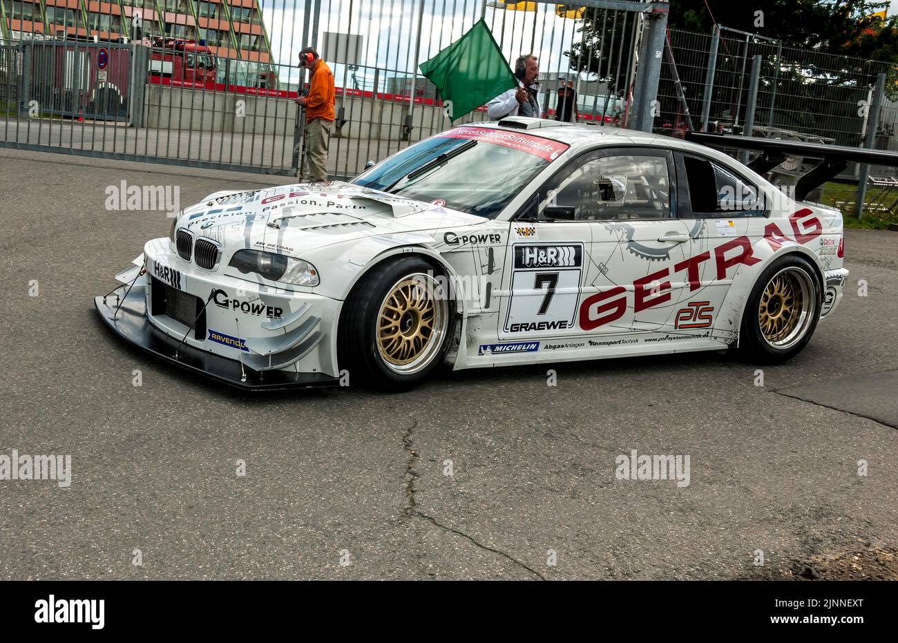 Race car BMW E46 V8 Kompressor sees green flag for exit on race track ...