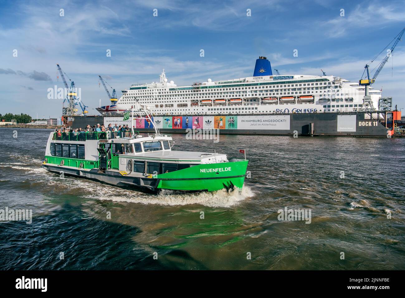 Excursion ship in front of the cruise ship Aurora in dry dock on the ...