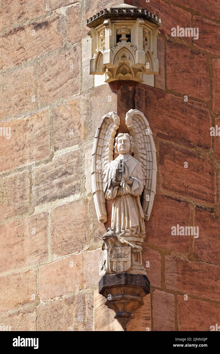 House sign, wall console with praying angel hewn from sandstone, above it Gothic figure canopy, sculpture on Nassauer Haus, reconstructed, on the Stock Photo