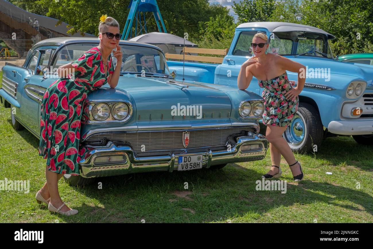 American vintage car with two woman with one woman Stock Photo