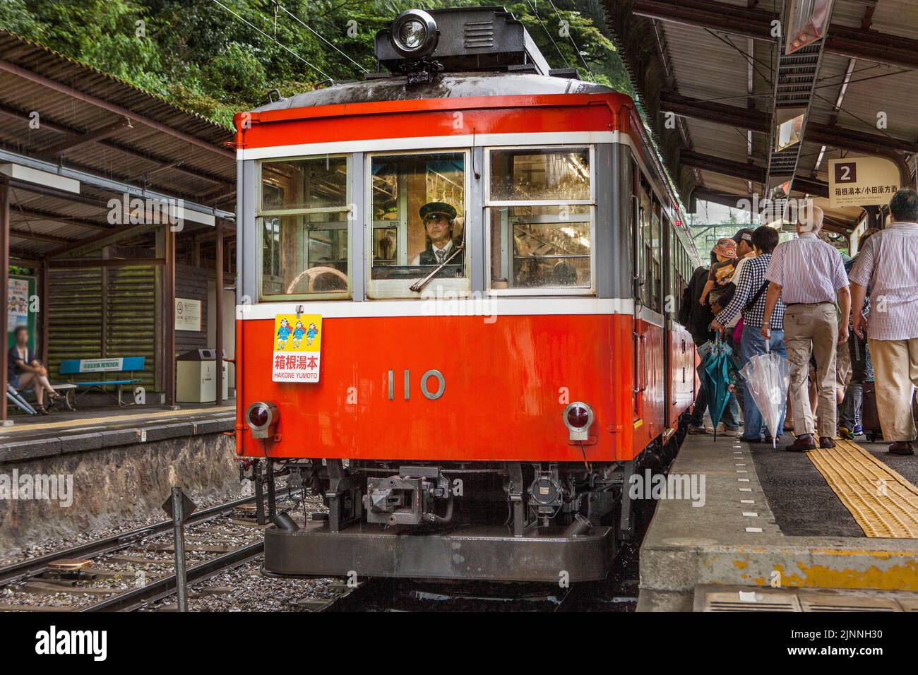 Local mountain train boards at station in Hakone Japan Stock Photo