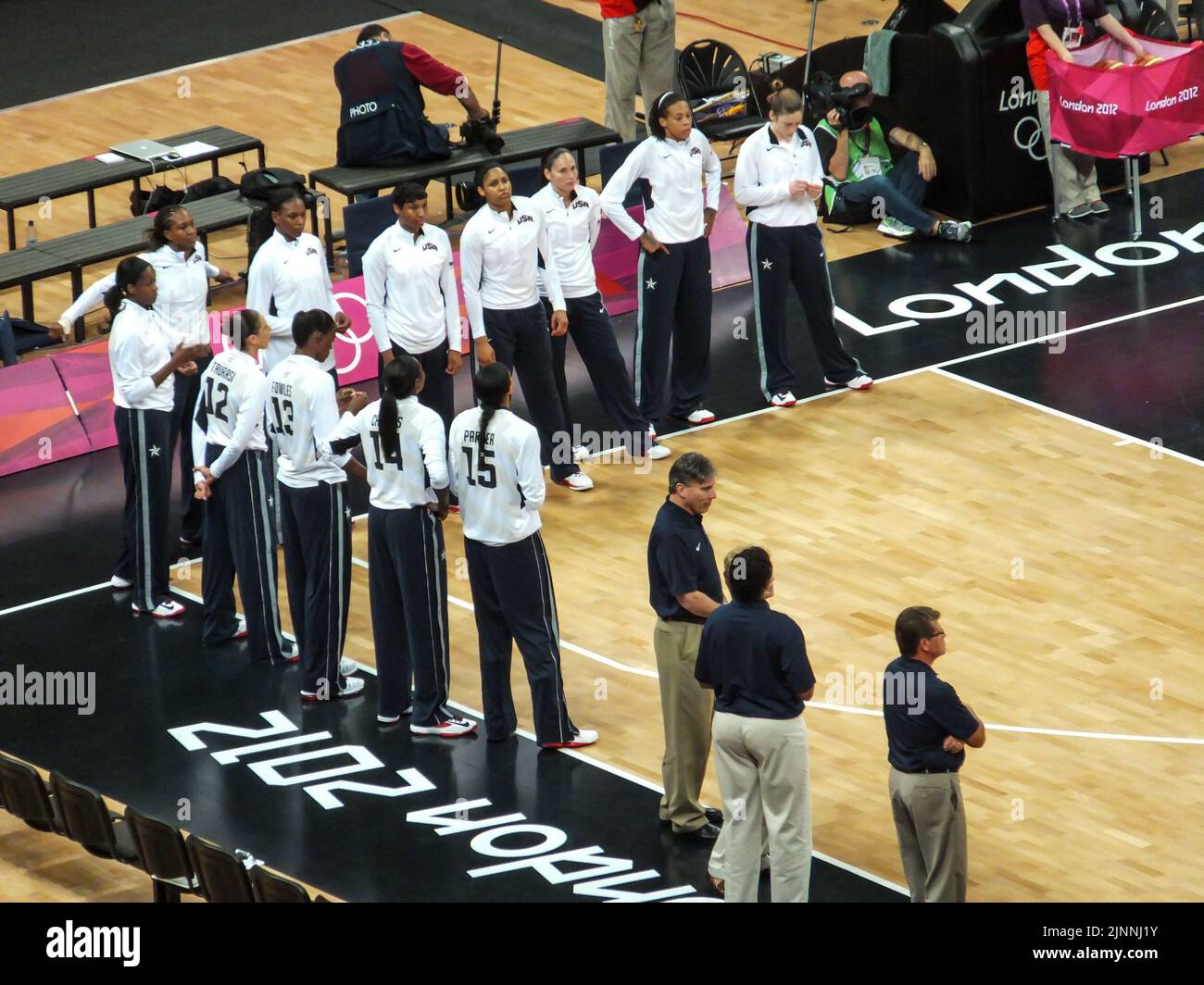 The United States Women's Olympic Basketball Team stands courtside prior to a game at the 2012 Summer Olympics in London, England, UK. Stock Photo