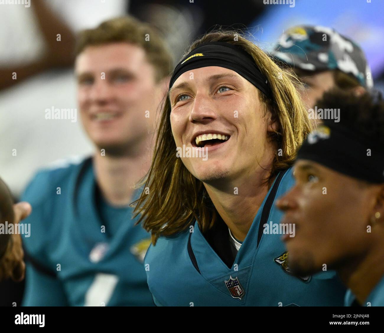 Jacksonville, USA. 12th Aug, 2022. Jaguars Quarterback Trevor Lawrence (c) smiles on the bench as the Browns take on the Jaguars in a pre-season game of the 2022/2023 season at the TIAA Bank Field in Jacksonville, Florida on Friday, August 12, 2022. Photo by Joe Marino/UPI Credit: UPI/Alamy Live News Stock Photo