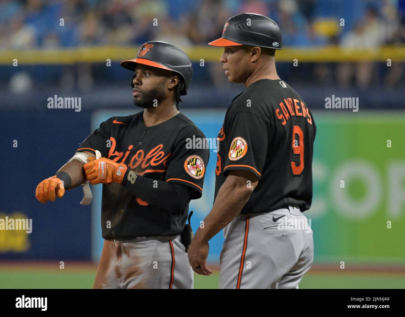 St Petersburg, USA. 12th Aug, 2022. Baltimore Orioles first base coach Anthony Sanders (9) talks with Cedric Mullins after his RBI-single off Tampa Bay Rays reliever Shawn Armstrong during the sixth inning at Tropicana Field in St. Petersburg, Florida on Friday, Aug. 12, 2022. Photo by Steve Nesius/UPI Credit: UPI/Alamy Live News Stock Photo