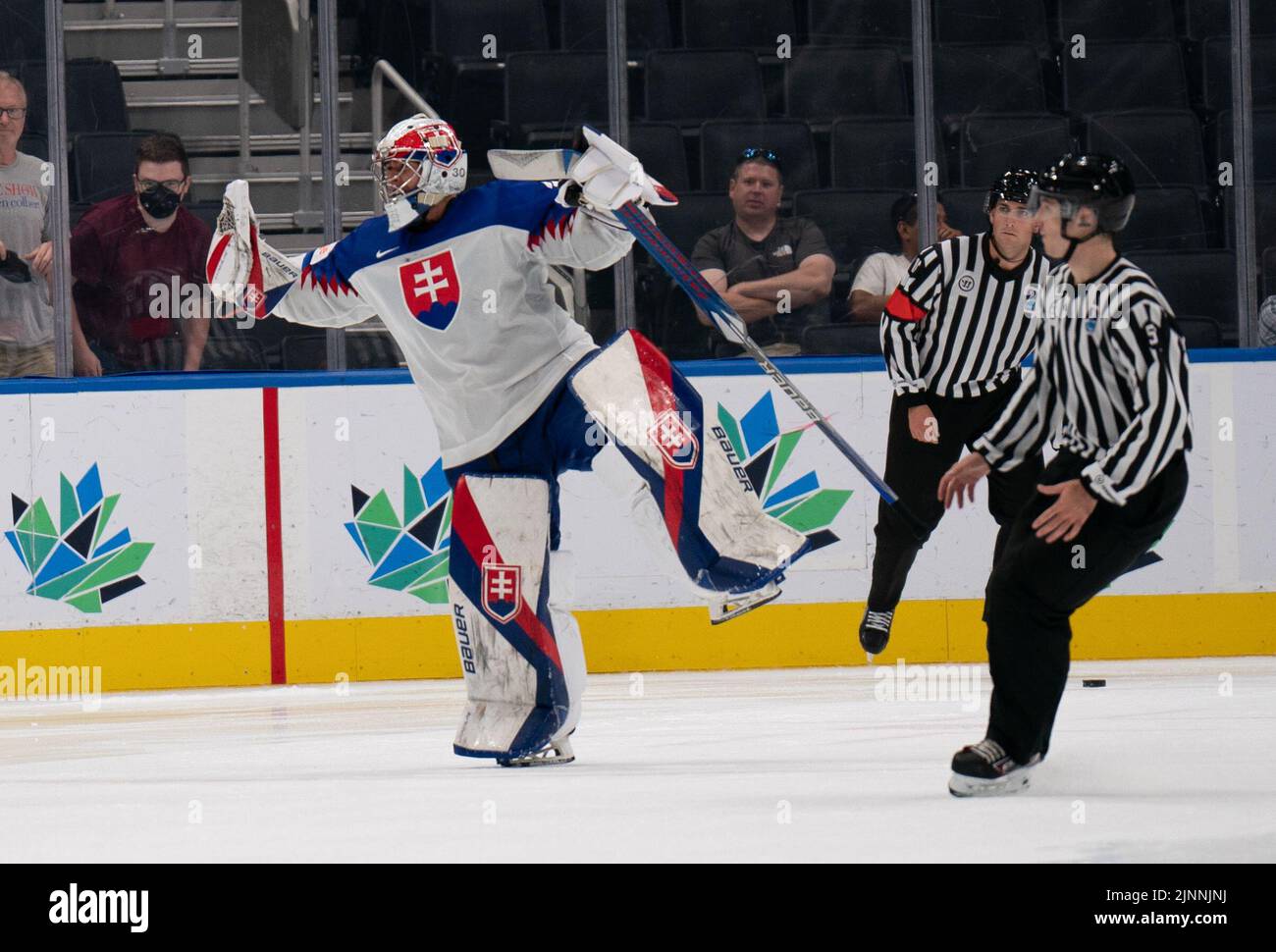 Edmonton, Alberta, Canada. 12th Aug, 2022. SIMON LATKOCZY (30) of Slovakia celebrates the victory during overtime at the World Junior Championships at Rogers Place in Edmonton, Alberta. (Credit Image: © Matthew Helfrich/ZUMA Press Wire) Credit: ZUMA Press, Inc./Alamy Live News Stock Photo