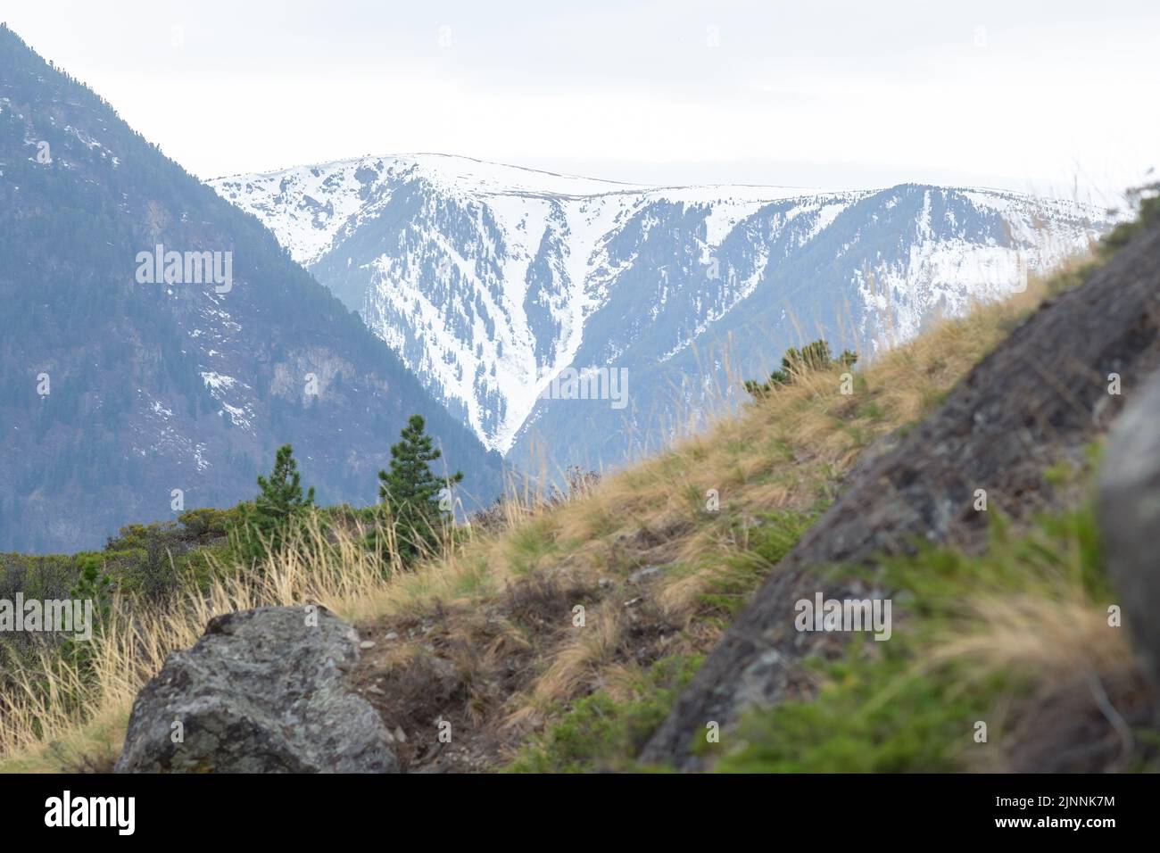 view of the landscape of a snow capped mountain peak, the peak of a ...