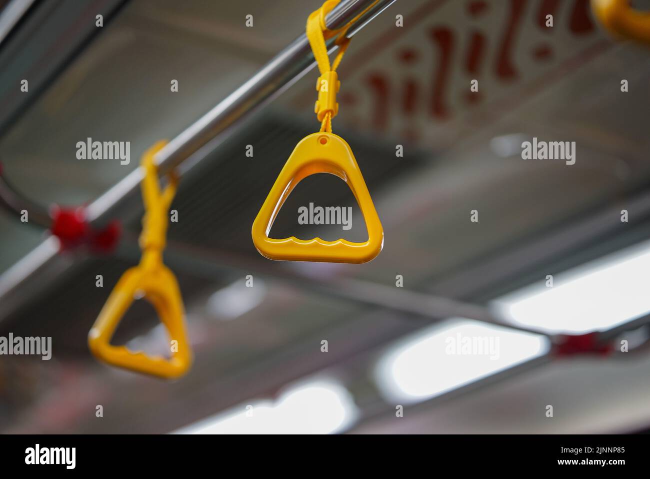 Hanging bus strap hi-res stock photography and images - Alamy