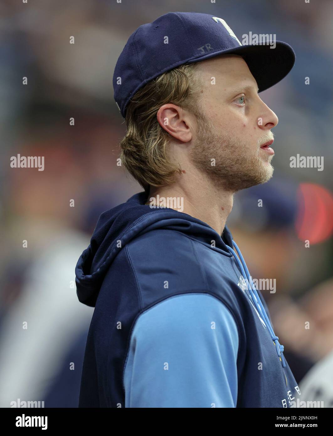 St. Petersburg, FL. USA;  Tampa Bay Rays rookie pitcher Shane Baz (11) who is on he 60-IL watches the game from the dugout during a major league baseb Stock Photo